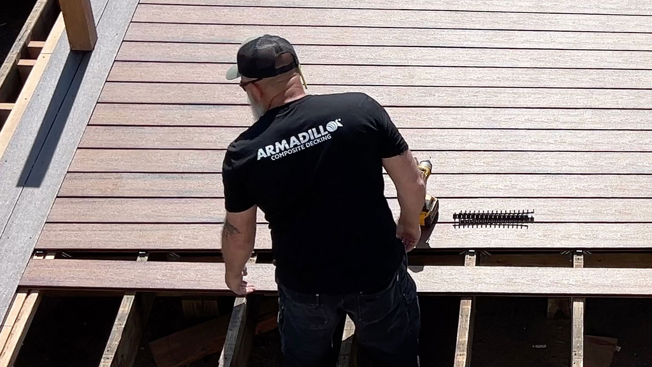 Deck builder constructing an Armadillo composite deck