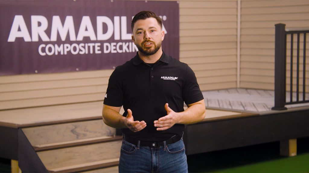 Derek from Armadillo standing in front of a newly built Armadillo composite deck