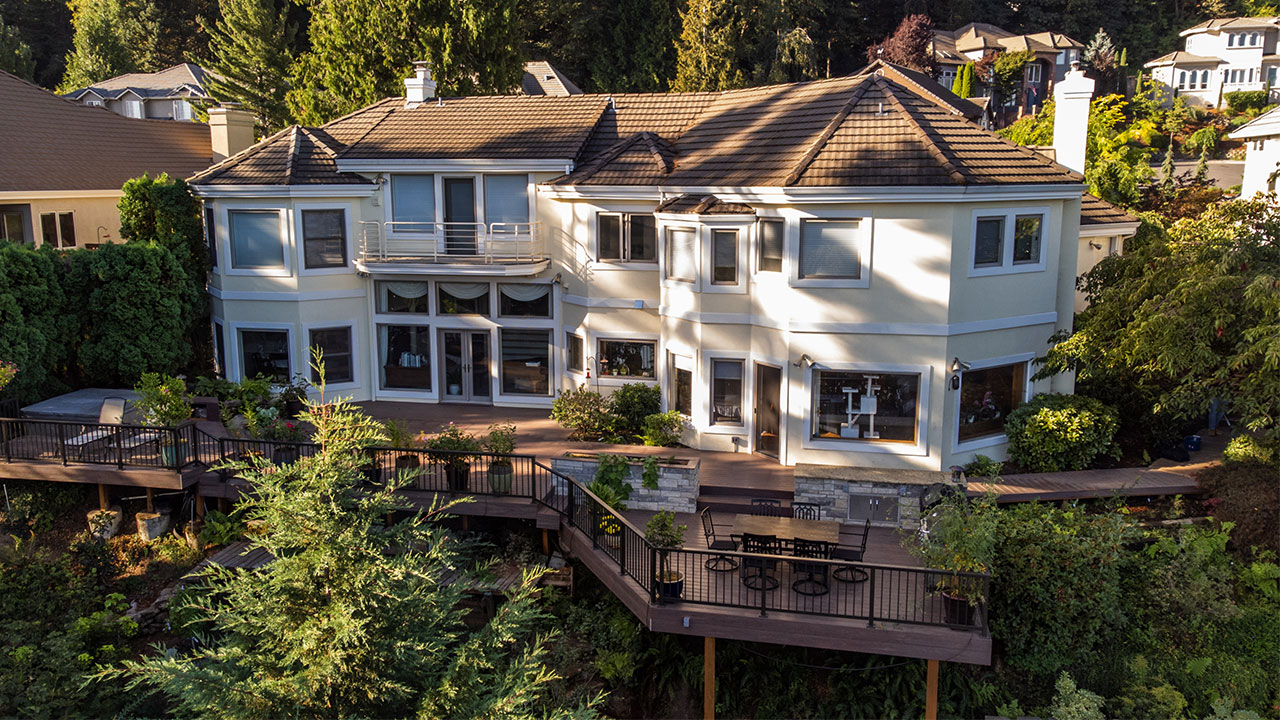 Finished composite deck featuring picture framing and transition boards for a professional, polished look