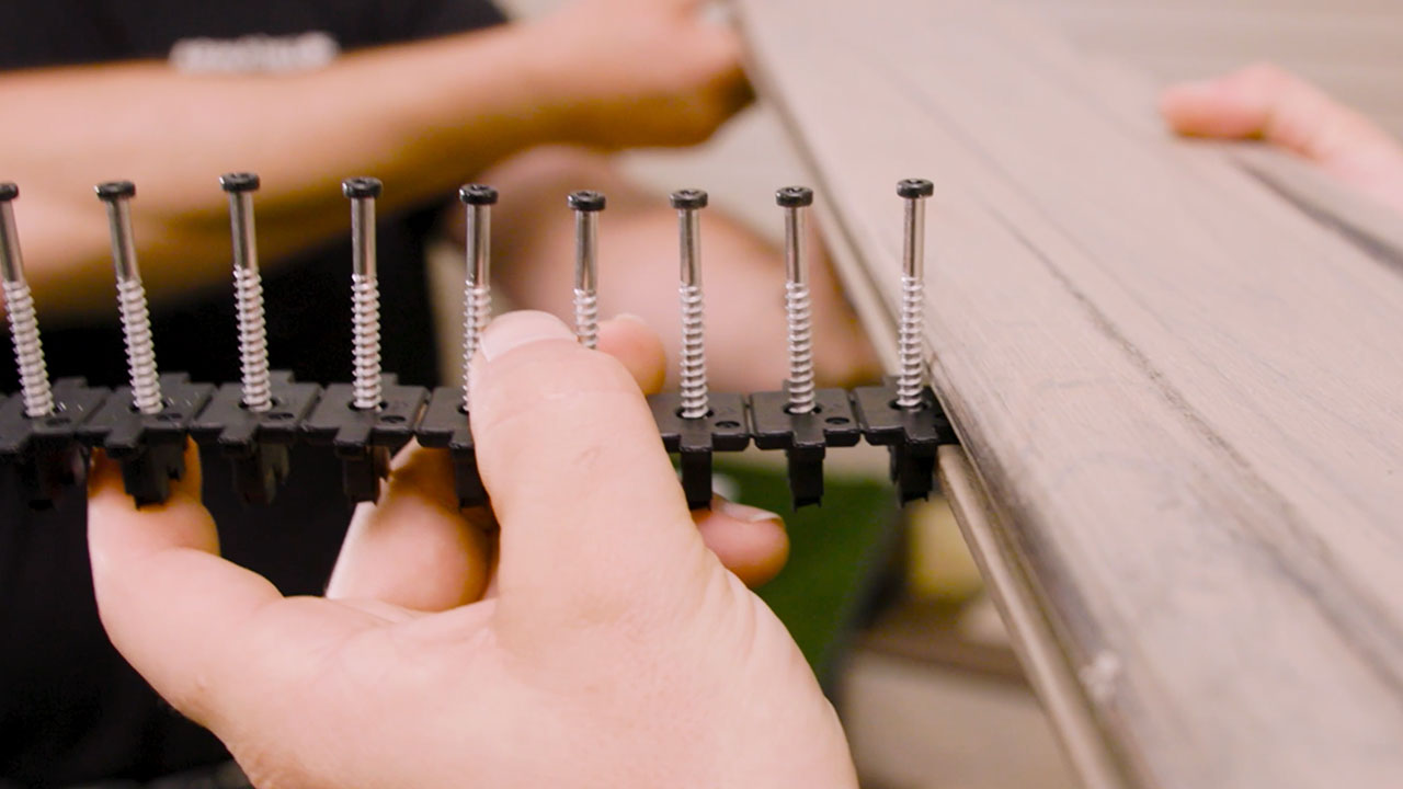Close-up of TurboClip hidden fasteners creating 3/16 inch spacing between composite deck boards